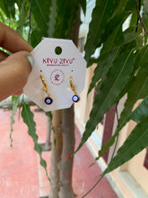 Evil eye gold tone earrings